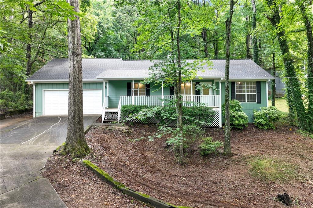 Discover COMFORT AND CONVENIENCE - ALL IN ONE PLACE. This 3 bedroom, 2 bath ranch invites you to enjoy a seamless blend of indoor comfort and outdoor serenity. Whether you're hosting game night on the screened porch or taking in the quiet, peaceful backyard, this is the kind of living that just makes sense. Freshly painted throughout, this home is move-in ready and waiting for you to make it your own. Nestled on a wooded lot, the setting offers the peace you crave with the practicality you need. TAKE THE NEXT STEP - schedule your private showing today and experience the ease of smart, simplified living.