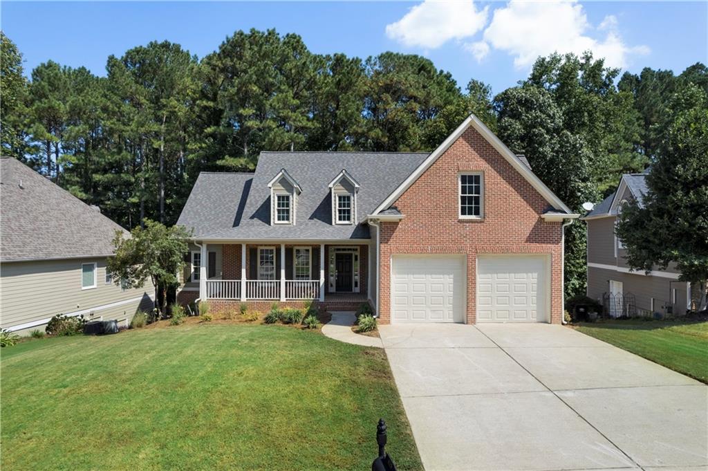 Welcome to this beautifully maintained 6-bedroom, 4-bath home in the sought-after Seven Hills community! The main level offers a spacious primary retreat with room for a cozy seating area. The en suite bath is a true oasis, featuring a soaking tub, walk-in shower, and double vanity creating the perfect place to relax and recharge. Two secondary bedrooms with a shared bath complete the main level. The kitchen, living, dining, and breakfast areas flow seamlessly together and open to the deck, ideal for entertaining.
Architectural touches and natural elements shine throughout including a brick fireplace, stone countertops, wainscoting, and beadboard accents.
Upstairs you’ll find a private bonus suite with a full bath that would perfect for guests, teens, or a home office.
The finished terrace level features a wide foyer-style hallway with two open flex spaces, ideal for a game area, lounge, or office. There is a larger living room with a window, two additional bedrooms, a full bath, a workshop/tool storage space, and a large unfinished storage room. Beautiful stonework adds warmth and character. Double-door walkout to the backyard makes the basement feel bright and functional.
Recent improvements include fresh paint, new flooring throughout, updated lighting, new deck boards and railings, & refreshed landscaping.
Seven Hills is known for its incredible amenities including a resort-style pool, splash pad, playground, tennis & pickleball courts, basketball courts, clubhouse, trails, and green spaces. This is an unbeatable location near Publix, restaurants, and major routes to metro Atlanta and North Georgia. Photos include virtually staged photography.