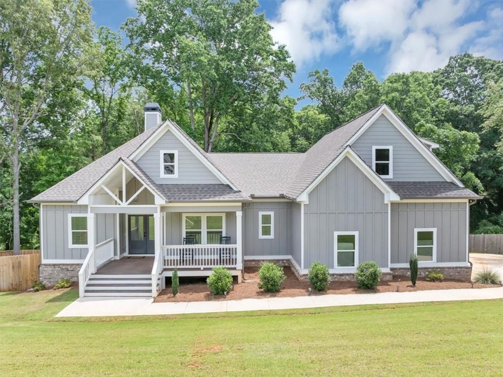 Country Charm Meets Modern Comfort at 1021 Windsor Creek Drive, Madison, Georgia. Discover your dream country home on over one and a half acres of beautiful, rolling land just minutes from the charming downtown of Madison. Built in 2023, this stunning custom-crafted Craftsman-style farmhouse offers three bedrooms and two baths, blending rustic appeal with contemporary conveniences. Inside, you'll find a spacious, open-concept living area perfect for family gatherings and entertaining. The heart of the home is a beautiful spacious kitchen, complete with a generous Butler’s pantry for all your storage needs, and an inviting eat-in area that flows seamlessly into the family room—ideal for relaxed country living. The luxurious primary suite features a large walk-in closet that connects directly to the laundry room and mudroom, making daily routines effortless. The primary bath is a peaceful retreat with modern fixtures and finishes. Upstairs, you'll find an unfinished attic space with a functioning bathroom—ready for your personal touch. Whether you envision a game room, man cave, arts and crafts studio, or future expansion, this versatile space offers endless possibilities. Step outside to enjoy your fully fenced backyard, enclosed with a new wood fence—perfect for kids, pets, or outdoor entertaining. The expansive yard offers plenty of space for gardening, play, or just relaxing in your peaceful country setting. All of this just minutes from downtown Madison’s historic shops, charming eateries, and vibrant community events. Experience the perfect blend of country serenity and modern living—schedule your tour today!