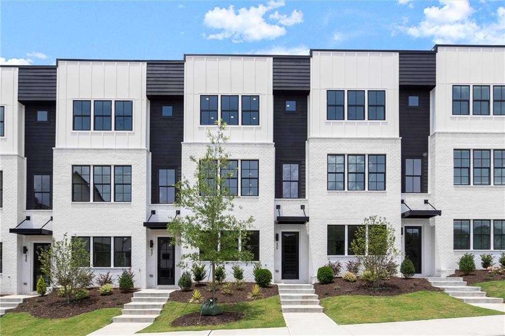 Introducing the Adeline, a Contemporary style townhome boasting 2,160 square feet of luxurious living space. With 4 bedrooms, 3.5 bathrooms, and three stories of thoughtfully designed interiors, this home offers the perfect blend of modern style and comfort. As you enter the first floor, you'll find a spacious guest suite complete with its own private bathroom, ideal for visitors or a home office. The entryway also provides access to the attached two-car garage, ensuring convenience. Ascend to the second floor to experience the heart of the home, an open concept living area designed for both relaxation and entertainment. The expansive living room, featuring 10 ft ceilings and large windows, seamlessly flows into the dining area and gourmet kitchen. The kitchen is a chef's dream, boasting Kitchen Aid stainless steel appliances, quartz countertops, sleek cabinetry and a generous island. The third floor is dedicated to privacy and tranquility housing the primary suite and additional bedrooms. The luxurious Primary Suite features a walk-in closet and spa-like en-suite bathroom with a raised maple dual vanity and glass enclosed shower. Two additional well-appointed bedrooms share a stylish full bathroom, and a laundry room on this floor adds to the home's functionality. Located in The Gathering, a Vibrant new community, just minutes from downtown Alpharetta, Avalon and top-rated schools as well as prime access to the Alpha Loop. Enjoy our community amenities such as a Community Garden, Firepit and Dog Park. This home provides the ultimate in modern suburban living. Experience the perfect combination of style, comfort and convenience!! Agent is on-site Monday, Tuesday, Thursday, Friday & Saturday (10:00-6:00) and Wednesday and Sunday (1:00-6:00).