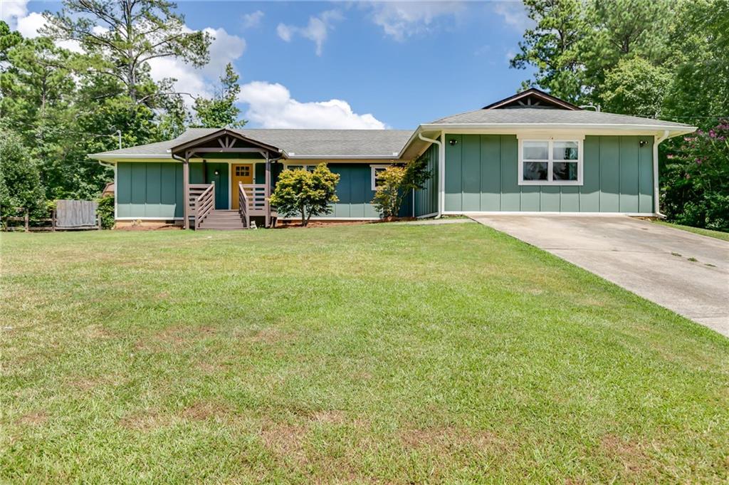 Welcome to the one you've been waiting for! This beautifully updated 4-bedroom, 3-bathroom home checks all the boxes! It is bursting with charm and ready to impress from the moment you pull up. Nestled behind a lush green exterior and set on a big front yard, this home blends curb appeal with comfort and functionality. Step inside to discover a spacious open-concept living room, perfect for relaxing or entertaining guests. The gorgeous walk-in pantry is a rare find and a dream come true for any home chef. Every inch of this home has been thoughtfully updated-modern finishes, sleek fixtures, and style that pops in every room. The oversized master suite is your private sanctuary, offering space to unwind in. Out back, enjoy a huge backyard with plenty of room for kids, pets, or summer BBQs. There's even a bonus shed for extra storage, a workshop, or your next creative project. Conveniently located, minutes to Carrollton, Villa Rica, Douglasville, and I-20. Centrally located! Move-in ready, and priced to sell-this home is a rare find that won't last long. Schedule your showing today and fall in love!