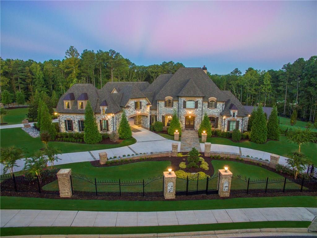The Pinnacle of Luxury living private 4+/- Acre Gated Estate,paneled study,chefs kit ,vaulted keeping rm w/fplace,wet bar.private master suite spa bath w/large custom closet,all secondary bedrooms are suites w/walkin closets & w/private baths, loft/library lounge Terrace level features bedrm/BA,fitness center,steam shower,media rm,Full kitchen,wine cellar,Covered veranda w/fplace,infinite edge pool w/waterfall amazing pool house w/summer kitchen,full bath,security system,surround sound,elevator,breathtaking Landscaping & vineyard,separate office,In-Law Ste,5 car garage