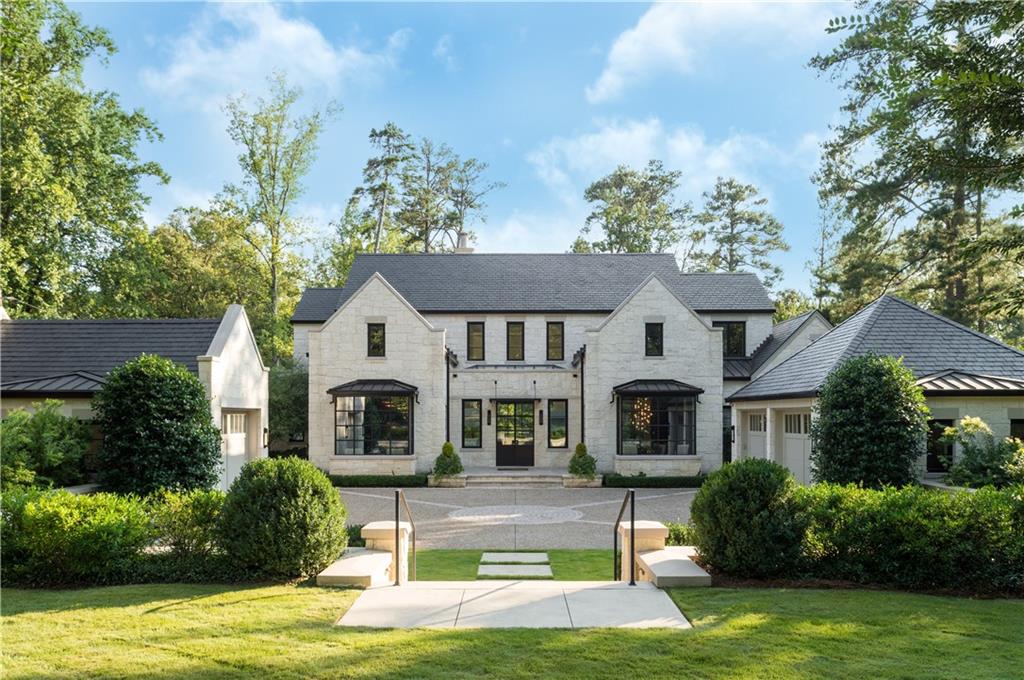 One step inside will take your breath away! This 2013 European-inspired masterpiece by TS Adams couples traditional exterior design with dramatic contemporary interiors. Interiors are bright and sophisticated - art walls, steel & glass open staircase, entry skylight and soaring ceilings. Outside includes a loggia w/double fireplace, stone terrace, heated pool w/spa, meditation garden and flat yard. Views are private. Feels like a resort! Tech features include elevator, smart remote controls, Geothermal HVAC, Sonos, Lutron, & high-tech security. Ample parking for guests.