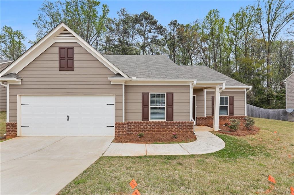 Receive $1000 off first month! Discover this charming 3-bedroom, 2-bath single-story home in Conyers, Georgia, offering 2,193 square feet of comfortable living space. Relax on the covered front porch before stepping into the spacious open-concept layout, where the kitchen shines with granite countertops, stainless steel appliances, and ample room for cooking and entertaining. Plush carpeting adds warmth to the bedrooms, while the primary suite features a walk-in closet and a luxurious en-suite bathroom with a separate soaking tub and walk-in shower. The fenced-in backyard provides a private space for outdoor enjoyment. Conveniently located close to shopping, dining, and everyday essentials, this home combines comfort, style, and an unbeatable location.