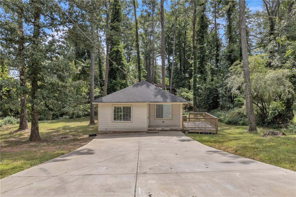 Renovated 3BR/2BA home on a spacious wooded lot! Featuring new floors, updated kitchen, stylish bathrooms, and fresh paint, this property already offers great potential. Please note: the home is not fully finished and still requires some work, giving buyers the chance to add their own final touches. Open layout with dining area, private deck, and long driveway with ample parking. Perfect for first-time buyers, families, retirees, or investors. Convenient to schools, parks, shopping, MARTA, I-75, and just minutes from Hartsfield-Jackson International Airport.