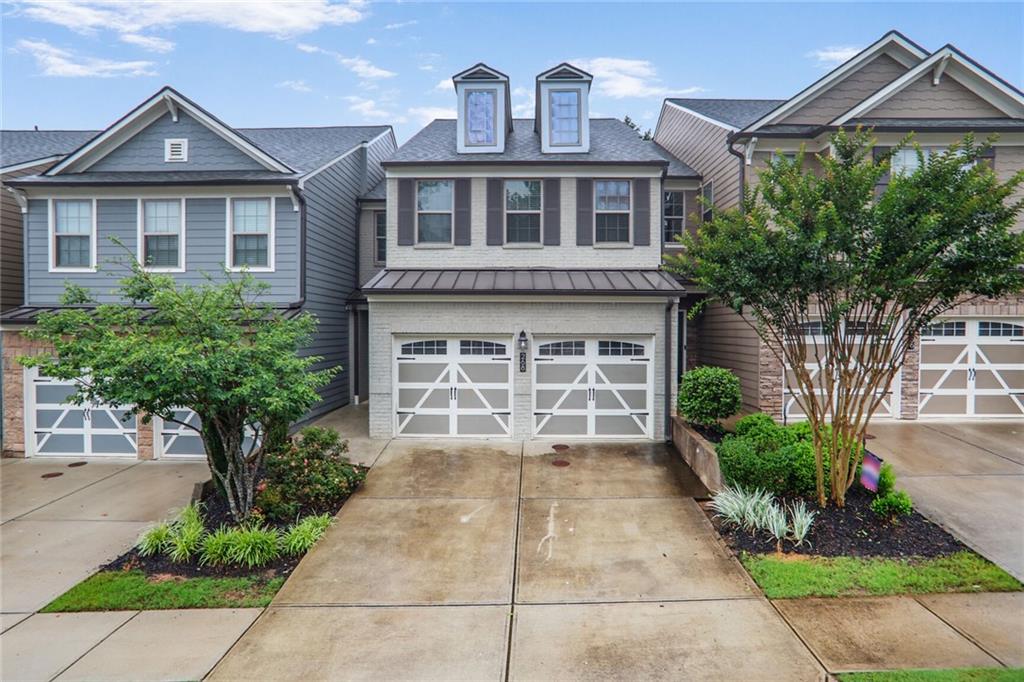 Charming recently renovated Craftsman townhouse in the heart of Woodstock. There is an entry foyer that leads to an open floor plan of a living room with fireplace, dining with access to the rear patio, and kitchen with white upper cabinets and darker cabinets lower, tile backsplash, Granite counters and breakfast bar, Stainless appliances (gas stove, microwave, dishwasher, refrigerator), pantry. Main floor access to the 2-car garage with auto-opener. Upper level features an ample hall space, laundry room with washer/dryer hook-ups, two spare bedrooms, a full hall bath with tub/shower combination. The master bedroom is spacious with a trey ceiling and ceiling fan. The master bath has dual vanities, Granite counters, tile floors, and walk-in shower, as well as a walk-in closet. Great location & schools, easy access to Highway 575 and downtown Woodstock with a variety of dining, shopping, and the Woodstock Outlet. No aggressive dog breeds.