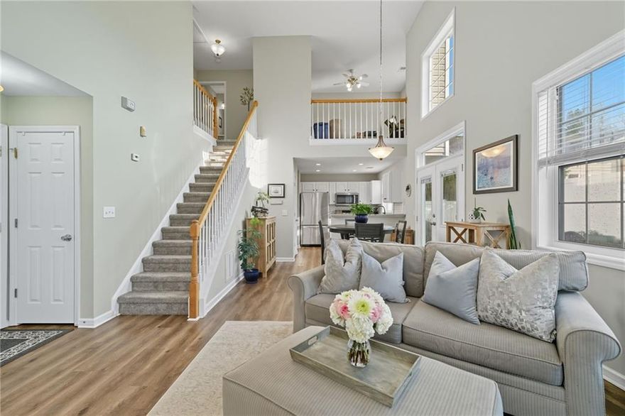 Welcome to this beautifully maintained 2-bedroom, 2.5-bath home with a versatile loft/flex space, perfectly located just minutes from the heart of downtown Woodstock. Step inside to find soaring cathedral ceilings and an abundance of natural light that create a bright, open feel. The kitchen is as stylish as it is functional, featuring white cabinets, quartz countertops, and stainless-steel appliances. Fresh paint, brand-new LVP flooring, and plush carpet add a modern touch throughout. Upstairs, the spacious loft offers endless possibilities—whether you need a home office, playroom, a cozy reading nook or even a 3rd bedroom. The two-car garage with overhead storage ensures plenty of room for organization. Enjoy outdoor living in your private courtyard-style backyard, complete with a fenced-in garden oasis perfect for those with a green thumb. Located in a quiet neighborhood where the HOA takes care of front yard maintenance, this home offers low-maintenance living in a prime location. Don’t miss the opportunity to own a charming home so close to all the shopping, dining, and entertainment Woodstock has to offer!