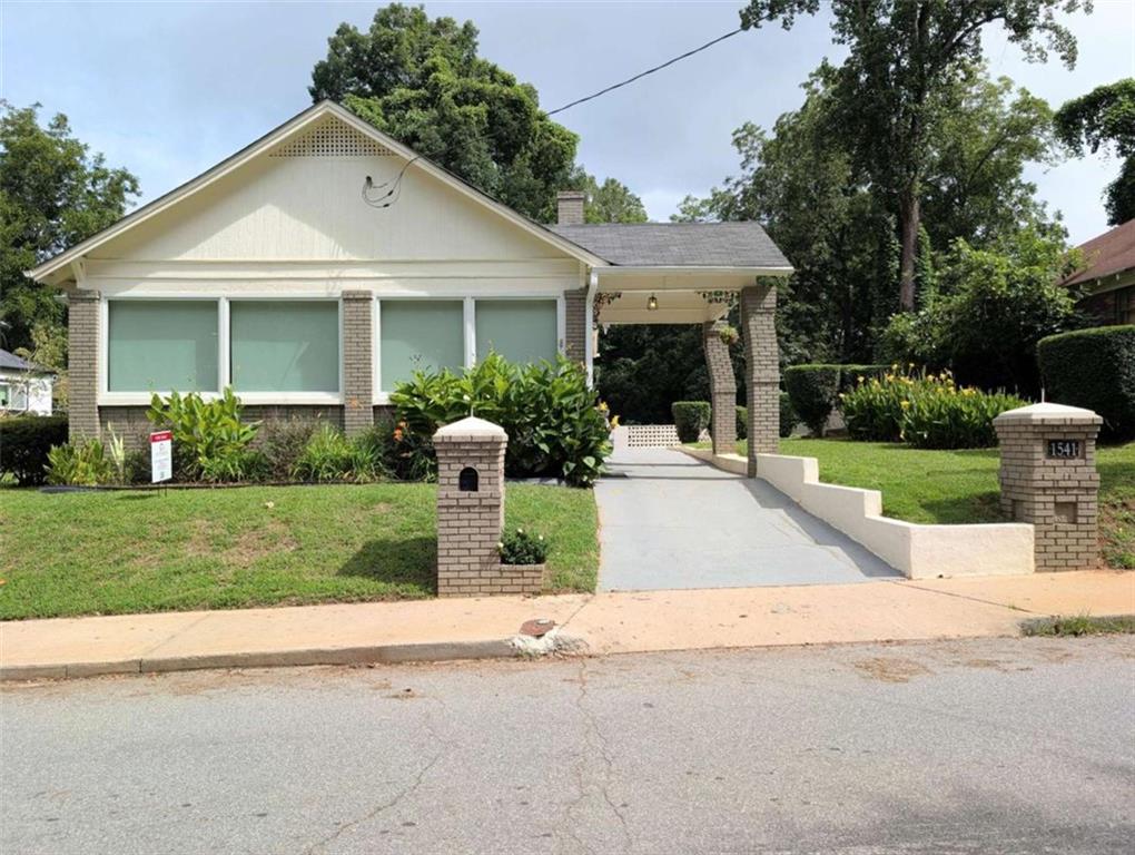 Updated Grove Park Bungalow. This home is eligible for Special 100% financing with NO PMI & below market rates. Featuring a new roof, new HVAC, new water heater, and new windows. Oversized kitchen with ample cabinet space and butcher block countertops. This home delivers worry-free living from day one. Inside, you'll find hardwood and tile floors, a bright sunroom with central heating and air, and an open layout that's perfect for entertaining or relaxing. The spacious rear deck overlooks a private backyard complete with a charming swing. Plenty of parking on-site, a rare find in this neighborhood. Conveniently located near Westside Park, the Atlanta BeltLine, and quick access to downtown, Midtown, and major interstates.