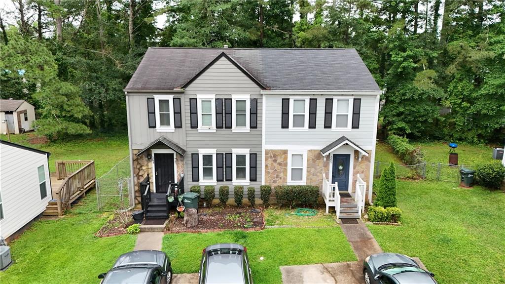 Welcome to your beautifully renovated 3-bedroom, 2.5-bath townhome in the desirable Pleasant Oaks community just minutes from vibrant Downtown Marietta! This thoughtfully updated home features brand new flooring, modern appliances, a new water heater, new HVAC system, and fresh interior and exterior paint, making it truly move-in ready. Step outside to a spacious, fully fenced backyard ideal for hosting friends and family. Unwind on the screened-in back porch overlooking a peaceful, wooded view and enjoy the privacy of your own outdoor retreat. Whether you're a growing family or looking to downsize into something low-maintenance and serene, this home offers the perfect blend of comfort, convenience, and charm. Located just minutes from Dobbins Air Force Base, Marietta Square, and I-75, come see what makes this Pleasant Oaks gem the perfect place to call home schedule your private showing today.