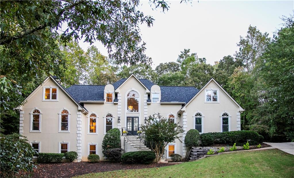Sophisticated Roswell Retreat in a Coveted Swim/Tennis Community
Discover the perfect balance of luxury, comfort, and convenience in this exceptional executive home, ideally located on a private cul-de-sac in one of Roswell’s most desirable neighborhoods. Just minutes from the boutiques, restaurants, and historic charm of Downtown Roswell, this residence offers the ultimate blend of lifestyle and location.
Step inside the grand two-story foyer and be welcomed into a sun-filled, open-concept floor plan designed for both refined entertaining and everyday living. The soaring fireside family room, framed by dramatic windows, flows seamlessly into the gourmet kitchen and formal dining spaces, creating an effortless setting for gatherings of all sizes.
The main-level primary suite is a private sanctuary featuring a fireside sitting area and a newly renovated, spa-inspired bath. A rare second en-suite bedroom on the main floor provides ideal accommodations for guests, in-laws, or multi-generational living. Upstairs, three spacious bedrooms and an oversized bonus room offer flexible options for teens, play, or media space.
The fully finished daylight terrace level expands the home’s living potential with a large family room, private office, bedroom, full bath, and additional bonus room—perfect for a home gym, hobby studio, or future bedroom suite. Outdoors, enjoy a beautifully designed stone patio with a freestanding fireplace, creating the perfect setting for al fresco dining or evening relaxation.
With fresh designer paint, a brand-new roof, and professionally maintained hard-coat stucco, this home is as move-in ready as it is timeless. Zoned to Roswell’s top-rated schools and surrounded by premier private academies, it offers convenience to top dining, shopping, and entertainment—many accessible by golf cart.
More than just a home, this is a lifestyle of elegance, space, and distinction.