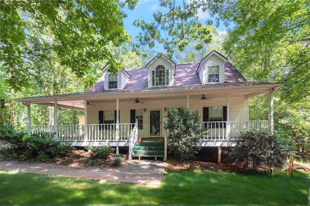 Charming Cape Cod Home on 5 Acres in South Douglas – USDA 100% Financing Eligible
Welcome home to this beautiful Cape Cod-style gem, perfectly nestled on 5 private acres in highly desirable South Douglas County. Enjoy a peaceful rural setting, top-rated schools, and the convenience of being just minutes from local parks, dining, and shopping—with easy interstate access and less than 40 minutes to Hartsfield-Jackson Atlanta Airport. Inside, the home is filled with natural light, featuring 9-foot ceilings, spacious rooms, and oversized walk-in closets throughout. The owners’ suite on the main level offers comfort and privacy, with three additional bedrooms upstairs for family or guests. The full basement adds incredible versatility, including a workstation for craftsmen, bonus/flex rooms, ample storage, and a separate entry—ideal for a home office, gym, or potential in-law suite. Outside, enjoy a wrap-around porch, oversized back deck, custom-built treehouse, and a play area, making it perfect for entertaining or relaxing in your own private retreat. The roof is only 2 years old, and the hot water heater was replaced just 3 years ago, offering peace of mind for years to come. Best of all, the home is eligible for 100% USDA financing, meaning no down payment is required. Don’t miss your chance to own this move-in-ready home with acreage, updates, and charm in one of South Douglas' most sought-after areas.