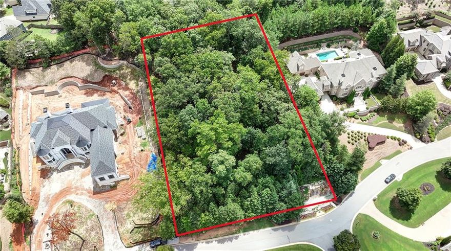 An exceptionally rare opportunity to build your dream residence at Grand Estates of the South!  Alpharetta's most exclusive gated community.  9715 Almaviva Drive, located on this 22 home enclave's main thoroughfare, is a 1.227 acre NW facing lot, boasting impressive curb appeal worthy of a finely constructed estate style home.  Grand Estates of the South is a private, gated community of european inspired estate style homes, beautifully landscaped, including a rustic pavilion and a stunning boulder and stone waterfall. 

Buildable lots of this caliber are hard to find in the metro area, enhancing the uniqueness of this prime property is its location within a private, gated community of substantial homes with impressive architecture.  This is a lot you will want to visit in person.  Please bring your architect and builder, only the lot is offered for sale.  Survey and elevation are available upon request.