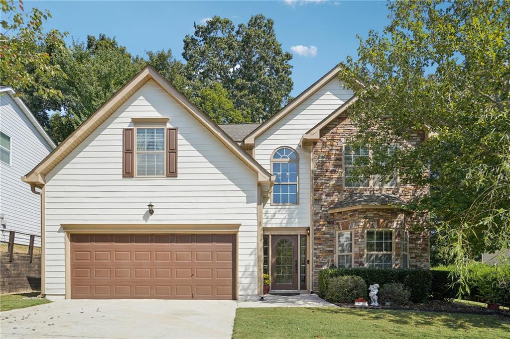 Welcome to this stunning 5 bedroom, 3 bathroom single-family home featuring modern updates and spacious living. A welcoming two-story foyer sets the tone, opening to a main level with all-new LVP floors and stairs for a fresh, seamless look. This home is filled with thoughtful improvements, including two new ceiling fans, a new fixture in the secondary bath, and a primary suite retreat showcasing a spa-like bath with double vanities, updated light fixtures, and modern faucets. Recent system upgrades add peace of mind, with a newly replaced A/C, a 4-year-old water heater, a recently replaced roof, and updated kitchen appliances including a multi-function oven with built-in air fryer. Enjoy a vibrant lifestyle with resort-style amenities, including a swimming pool with kids pool, basketball court, tennis courts, playground, walking trails, and a dog park. The Riverbrooke neighborhood connects to the Windemere Park, which includes a dog park, nature trail and walking trails. Within close proximity to Old Atlanta Recreation Center on Nichols Road, across the street from Lambert High School. This home combines comfort, convenience, and community living all in one exceptional property. Move-in ready and packed with upgrades, it’s the perfect place to call home! Max - Sweet dog is caged in the sitting area of the Primary Bedroom.