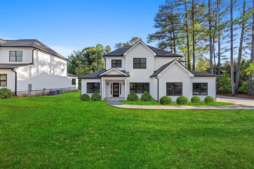 Welcome to this newly built modern farmhouse located in the Kincaid/Simpson/Sprayberry school district.
Situated on a half-acre lot, this home is loaded with high-end upgrades and luxurious finishes.

A striking two-story foyer greets you upon entry, while the open floor plan, designer lighting, and abundant natural light create a bright and welcoming atmosphere on the main level.

The living room features a sleek fireplace with a marble tile surround, offering a cozy yet elegant focal point for gatherings. The chef’s kitchen is outfitted with top-of-the-line Thermador appliances, including a built-in refrigerator and pull-out microwave drawer. An oversized island, custom cabinetry with double pull-out spice racks, and an adjacent butler’s pantry make this space as functional as it is impressive. A large walk-in pantry adds even more storage.

The primary suite on the main level boasts elegant double tray ceilings, a spacious walk-in closet, and a spa-like bath with dual vanities, an oversized glass walk-in shower, and a soaking tub.

Each bedroom is generously sized and includes its own ensuite bath, walk-in closet, and individual thermostat—a rare and thoughtful feature that ensures comfort and privacy for all. The home also includes a zoned HVAC system and a tankless water heater for maximum energy efficiency.

Upstairs, you’ll find a second laundry room and extra-large secondary bedrooms—perfect for a growing family or out-of-town guests.

Step outside to the back patio, ideal for grilling or relaxing while enjoying the peaceful backyard.

A long, wide driveway offers plenty of parking for guests, multiple vehicles, or even an RV.

Don’t miss your chance to own this beautifully designed, thoughtfully appointed home. Schedule your tour today—this one won’t last!