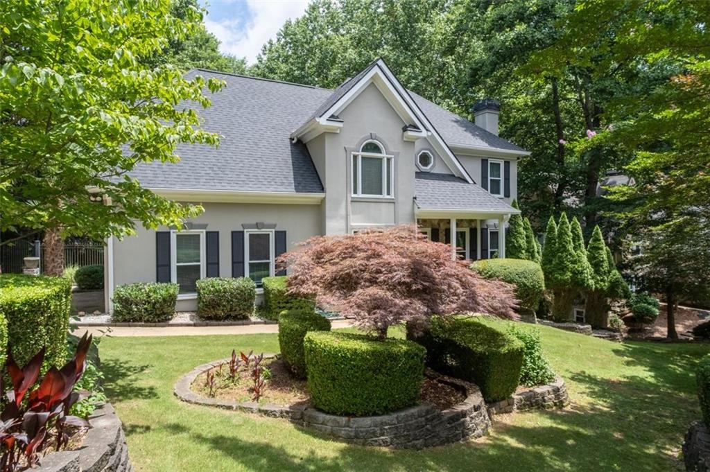 PRICE IMPROVEMENT! Country Club Living in the Heart of Woodstock!
Welcome to a home that offers more than just a place to live—it’s a lifestyle! Located in one of Woodstock’s most desirable Swim-Tennis-Golf communities, EAGLE WATCH with lite sidewalks, walking trails, large lots, and top-rated schools!
Tucked away on a peaceful cul-de-sac street, this Beautifully Updated 4-bedroom, 3.5-bath estate blends timeless elegance with thoughtful functionality and versatility!
From the moment you arrive, you’re greeted by professional landscaping, a long driveway with ample parking, and a side-entry garage complete with workbench and custom shelving. The New Roof, Gutter guards, Sprinkler System, Freshly sealed Stucco and Fresh paint thruout are Perfect for beauty, long term protection and Peace of mind!
Inside, you will be greeted by a dramatic two-story foyer, genuine FRESHLY refinished hardwoods on both main and upper levels! The sunlit family room is anchored by a striking stone fireplace! The Separate Dining Room is large with a beautiful view and the luxurious backyard!
The Chef’s kitchen features ultra-rare European cabinetry, Dual ovens and Dual new STAINLESS STEEL Refrigerators, Solid Surface Countertops, and a spacious Breakfast area opening to your Private Upper Deck—ideal for morning coffee and evening delights!
Upstairs, the oversized Owner’s suite features HighTrey Coffered Ceiling, a Cedar-lined walk-in closet and newly Upgraded Bathroom with Marble finishes! Two additional bedrooms with its full bath is an absolute delight for any size family! A laundry room on the second floor adds everyday ease and convenience. Storage is abundant!
Downstairs, the fully finished spacious basement offers a bathroom, two rooms perfect for a Media room, Fitness Gym or Office! It includes walk-out access to a second private deck—perfect for entertaining guests or multi-gen living!
Your Private Luxious Backyard Oasis is truly something special! Professionally landscaped with stacked stone accents, mature vines, and the feel of a hidden villa in the hills of Italy, it’s a place to relax, play, and dream! The fenced yard includes a play set and backs to a tranquil wooded valley leading to a creek—with deer sightings and nature at its finest! This is more than a home—it’s where your next chapter begins!!