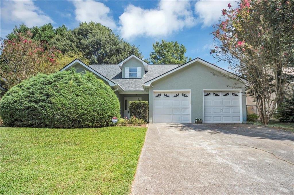 Beautifully Renovated Home in Prime East Cobb Location! Conveniently located near shops, restaurants, Kennesaw State University, and outlet malls, this charming home offers both comfort and convenience. Situated in a quiet, established neighborhood, the home features a sought-after floor plan with the primary suite on the main level. An additional bedroom and full bath are also on the main level. Upstairs, you'll find a third bedroom with its own private bath, along with a versatile bonus room perfect as a 4th bedroom, office, or media space. The updated kitchen boasts granite countertops, and all appliances remain. Enjoy cozy evenings by the fireplace in the inviting living area. Step outside to a fully enclosed patio overlooking a private, fenced backyard—ideal for relaxing or entertaining. Major updates include a new roof, new HVAC system, and new water heater. No carpet throughout for easy maintenance. Move-in ready and a must-see!