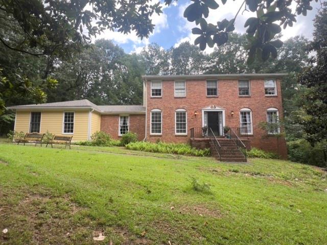 If you are looking for the next great investment or the best deal in East Cobb, this incredibly priced home in Jefferson Township is the one. Priced well below the neighborhood sales of over 800k, this home is ready for your sweat equity or investment dollars. Featuring 4 bedrooms and 3 full bathrooms, this home is full of potential. On the main level you will find a large eat-in kitchen, laundry room, separate dining room, formal living, and a family room with a brick fireplace. There is also a bedroom and full bathroom. The upper level gives you a large owner's suite with sitting area and a bathroom with dual closets, a garden tub/shower combo, dual vanities, and another separate walk-in shower. There are two additional ample sized bedrooms that share a large bathroom with vanity room and separate toilet and shower room. There is even a full unfinished basement with tall ceilings for even more potential. The home has had all the siding replaced with James Hardie fibre cement, has a newer roof, and updated HVAC system. While this home is perfect for the savvy investor, it does qualify for financing offers. This home is being sold "as-is".