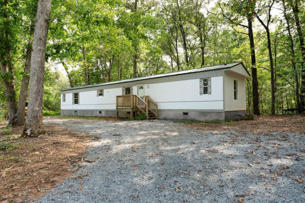 Welcome to your serene oasis! This beautiful 3-bedroom, 2-bathroom home offers, 1,120 square feet of comfortable living space designed for both relaxation and convenience. Perfectly situated just minutes from shopping, dining, exciting lake adventures, and so much more, this home provides the ideal balance of peace and accessibility. Whether you're looking for a full-time residence or a weekend retreat, this property is the one you've been waiting for?? Don't miss your chance let's schedule a tour!