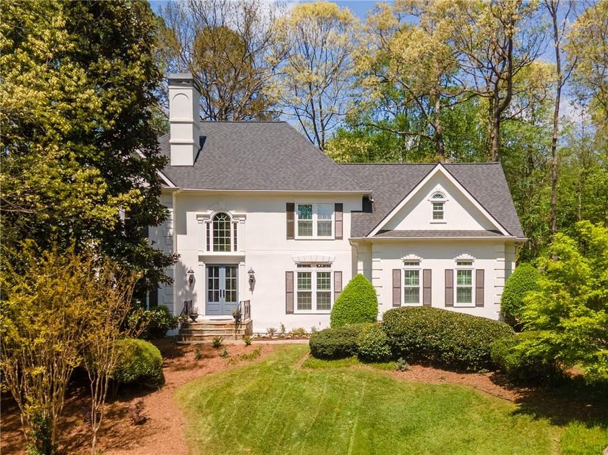 Welcome to this stunning European traditional-style residence nestled in the sought-after Sentinel Lake subdivision in East Cobb. Perfectly situated
on a quiet cul-de-sac, this impeccably maintained home offers elegant living with serene lake views and access to top-tier schools—Eastvalley
Elementary, East Cobb Middle, and Wheeler High.
From the moment you enter the gracious two-story foyer, you’ll be captivated by the home’s timeless charm and thoughtful layout. The main level
features a sophisticated living and dining wing, a spacious office (or optional main-level bedroom) with an adjacent
full bath, and a chef’s kitchen that’s both functional and beautiful. Enjoy a generous center island, hidden walk-in pantry, gas cooktop, and abundant
counter and cabinet space—all overlooking the bright fireside family room and a cozy breakfast nook.
Step outside to your private oasis, complete with a screened-in porch, adjoining deck, and patio—perfect for dining al fresco or unwinding with a view.
Inside, 10-foot ceilings and an open floor plan offer an airy and inviting feel throughout.
Upstairs, the expansive owner’s suite is a true retreat, featuring vaulted ceilings, a fireplace, and tranquil lake views. The luxurious en suite bath
boasts double vanities, a freestanding soaking tub, and a separate shower. All three secondary bedrooms include private, connecting baths and
spacious closets.
The fully finished terrace level is a showstopper, offering a custom wet bar, a 1,200+ bottle temperature-controlled wine cellar, a home theater, game
room, additional living area, and a workshop for hobbyists. Even the garage is heated and cooled for year-round comfort.
Enjoy access to community amenities including a picturesque lake, fishing, and walking trails—all just steps from your door. With newer roof, HVAC
systems, paint, twin hot water heaters and a natural gas generator with surge protector, this home is move-in ready and designed for both entertaining and everyday living.