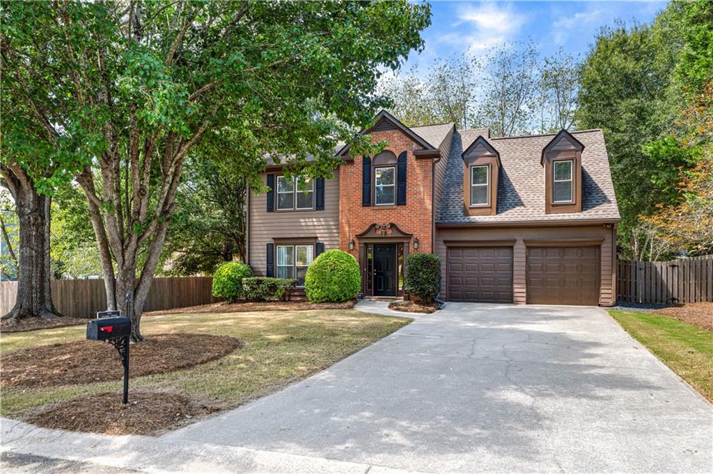 Dreaming of a home where the only thing left to do is enjoy it? Well, come right home to Halstead Lake! This extremely well-maintained 4-bed, 2.5-bath home in a top Cobb school district (Hillgrove, Lovinggood, Still) is a no-brainer—perfectly situated on a cul-de-sac in a great neighborhood with community swimming pool and lake with dock for fishing. Inside you'll find a spacious living room with fireplace, separate dining room, remodeled eat-in kitchen with granite counters, and a half bath on the main. Upstairs offers a large primary suite with ensuite bath featuring double vanities, separate shower and soaker tub, and a big closet, plus generous secondary bedrooms, updated secondary bathrooms and convenient laundry. The 2-car garage is right off the kitchen for easy access. The backyard is a dream—fenced, level, and park-like with a great patio for relaxing or entertaining. And the upgrades? The big-ticket items are already done for you including insulated double-pane windows (2019), upgraded 5-inch gutters with gutter guards (2020), new kitchen cabinets (2020), updated bathrooms (2022), Lennox HVAC (2014), new fence (2022), newer roof (2017), and fresh paint in decorator colors (2017). Impeccably maintained and thoughtfully updated—this home is truly move-in ready. The location can't be beat. Wonderfully situation near great schools, shopping (including The Avenues of West Cobb, Target, Publix, Kroger, Home Depot, Lowes, Marshalls & more) gyms, dining, several parks, Green Meadows Preserve, Marietta Square, and commuter routes including East-West Connector, 285 and 75.