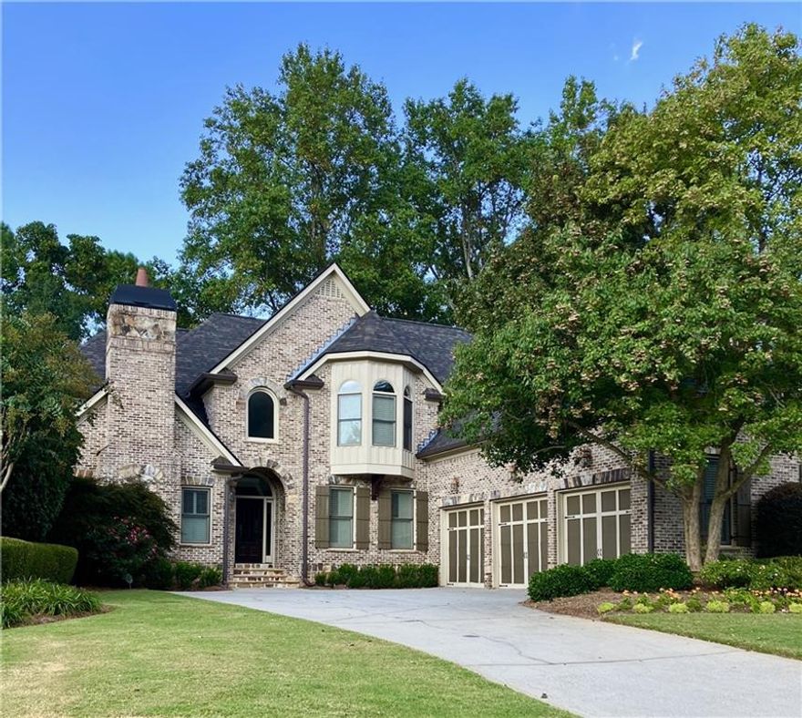 Welcome Home to 2415 Wistful Way

Searching for a Master on Main and a home that seamlessly blends elegance with comfort? This 5-bedroom, 5.5-bath executive residence, custom-built in 2004, is perfectly situated in one of East Cobb’s most desirable neighborhoods, celebrated for its top-rated schools, nearby shopping, dining, and recreational parks.

Tucked away on a private street and set on nearly half an acre, the property greets you with meticulously maintained landscaping, timeless curb appeal, and a spacious three-car garage. Inside, the expansive open floor plan welcomes you into a stunning living room featuring built-in cabinetry, a grand fireplace, soaring ceilings, and immaculate hardwood floors.

The gourmet kitchen is the heart of the home, boasting a WOLF five-burner gas cooktop, WOLF double ovens, and Subzero Refrigerator/Freezer, oversized eat-in island, custom cabinetry, and a walk-in pantry. Designed for both entertaining and everyday living, the kitchen flows effortlessly into the fireside family room and sunny breakfast area, while a separate formal dining room provides the perfect setting for special occasions.

The main-level master suite is a private retreat, complete with a cozy fireside sitting area, dual walk-in closets, and the spa-inspired bathroom with his and hers vanities, a relaxing soaking tub with jets, and separate shower with double showerheads, designed for relaxation. Upstairs, you’ll find a private office/den and three spacious bedroom suites, each offering a full bathroom and walk-in closet.

The fully finished terrace level expands the home’s versatility, offering a private office, guest suite with full bath, large living area, and a theater/media room ideal for movie nights. Entertain with ease in the second full kitchen and bar area, or host wine tastings in your very own tasting room. French doors open to a beautifully designed stone patio and outdoor kitchen, all surrounded by a serene, park-like backyard oasis.

With masterful craftsmanship, thoughtful updates, and a warm, livable design, this home truly has it all. Whether you’re hosting a large gathering or enjoying a quiet evening by the fire, 2415 Wistful Way delivers the perfect balance of luxury, privacy, and comfort.

Don’t miss this rare opportunity to make this stunning residence your forever home.