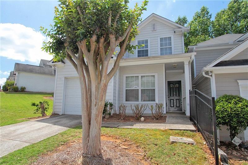 Beautifully maintained 3-bedroom, 2.5-bath home in the highly sought-after Copper Springs community. This spacious home features a main-level primary suite for ultimate convenience and comfort. Upstairs includes two secondary bedrooms, a full bathroom, and a large loft area perfect as a family room, home office, or playroom. Enjoy a private backyard patio with tranquil wooded views, ideal for relaxing or entertaining. Located just minutes from UNG, I-985, shopping, dining, and more. Additional features include a one-car garage with driveway space for one additional vehicle. Please note: no street parking permitted. *Additional $40.00 per month Resident Benefit Package Fee includes insurance and more!