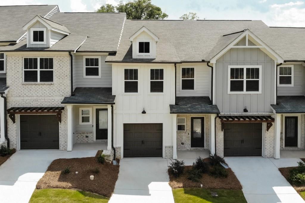 The Willow plan built by Create Homes. Quick Move-In! Enjoy the convenience of prime location close to shopping, dining, Hartsfield-Jackson International Airport, I-285, I-20, I-75 and the East-West Connector. Within walking distance to vibrant downtown Austell, this stunning new residence seamlessly blends contemporary style with functional living, creating a space that elevates your everyday. Enter into the open-concept main level which offers a modern kitchen featuring stylish countertops, stainless steel appliances, a spacious island, and soft-close cabinets and drawers. This space seamlessly flows into the dining and living areas, making it ideal for both everyday living and entertaining. A private rear patio extends your living space, providing a great spot to unwind and enjoy the outdoors. Upstairs you'll find the primary suite offers a spacious retreat with a double vanity, a walk-in closet, and modern hardware and fixtures for a sleek, contemporary feel. The laundry room is conveniently located nearby, and two secondary bedrooms with a full bath completes this floor. Built by Create Homes, this energy-efficient townhome features smart home technology and quality construction. Ask us about our up to $5,000 towards closing costs or options incentive*. Must use Seller's Preferred Lender with binding contract by 09/30/2025 and close by 10/30/2025. Secondary photos are of the standing Model Home, listing color selections vary. Kitchen and Master Bath are of the actual home.