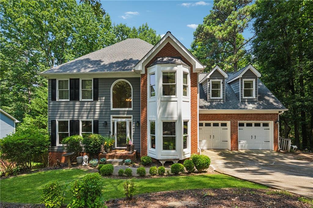 OPEN HOUSE THIS SUNDAY 7/20. 2PM-4PM. ALL BUYERS WELCOME! Nestled within the esteemed Eagle Watch golf community in Woodstock, Georgia, this well maintained 4-bedroom, 2 full bathroom and 2 half bathroom home offers an expansive 3,495 sq ft of living space on a serene fenced lot overlooking the woods. Designed with a spacious layout, hardwood floors, a white cabinet kitchen equipped with stainless steel appliances, tiled backsplash and granite countertops plus a lovely bay window accented breakfast nook overlooking the woods. You will love the large family room with new floors and centered by a gas fireplace and tons of sunlight fill this room and flows into the front living room. The primary suite serves as a private sanctuary, featuring a sitting room area with room for an electric fireplace or an office space. The large en-suite bathroom has an elongated counter with makeup vanity and a large walk-in closet. The main level is bright and cheerful and laid out perfectly. Half bath on main. The upstairs has 2 additional secondary spacious bedrooms one of which is very big and overlooks the front of the home. The terrace level is finished with 2 additional bedrooms and an almost complete full bathroom, which currently is a functioning half bathroom and just needs a shower, floors and drywall. The hard parts have been completed with the plumbing. A large rec room and another deck overlooking the fenced backyard. You also have ample storage space with built in shelving. Low maintenance yard and cul-de-sac street in a highly sought after community with top rated schools. Walk to the pool from your home too. New hot water heater, new garage doors, newer deck, all new light fixtures and door hardware, new floors upstairs. Lots of new, move in ready! Two decks overlooking the back yard. Residents of Eagle Watch enjoy access to a range of amenities, including three sparkling pools, lighted tennis and pickleball courts, a fitness center, playgrounds, and scenic walking trails. The community is also home to the award-winning Canongate Eagle Watch Golf Course with a restaurant on site. Just a short drive away, Downtown Woodstock offers a vibrant mix of dining, shopping, and entertainment. The area hosts year-round events, including a summer concert series and seasonal festivals, creating a lively atmosphere. Outdoor enthusiasts will appreciate the proximity to Lake Allatoona and Red Top Mountain State Park, while the Noonday Creek Trail, a multi-use path, connects the neighborhood to Downtown Woodstock, offering scenic routes for walking and cycling. This home combines luxury living with a strong sense of community, making it an ideal choice.