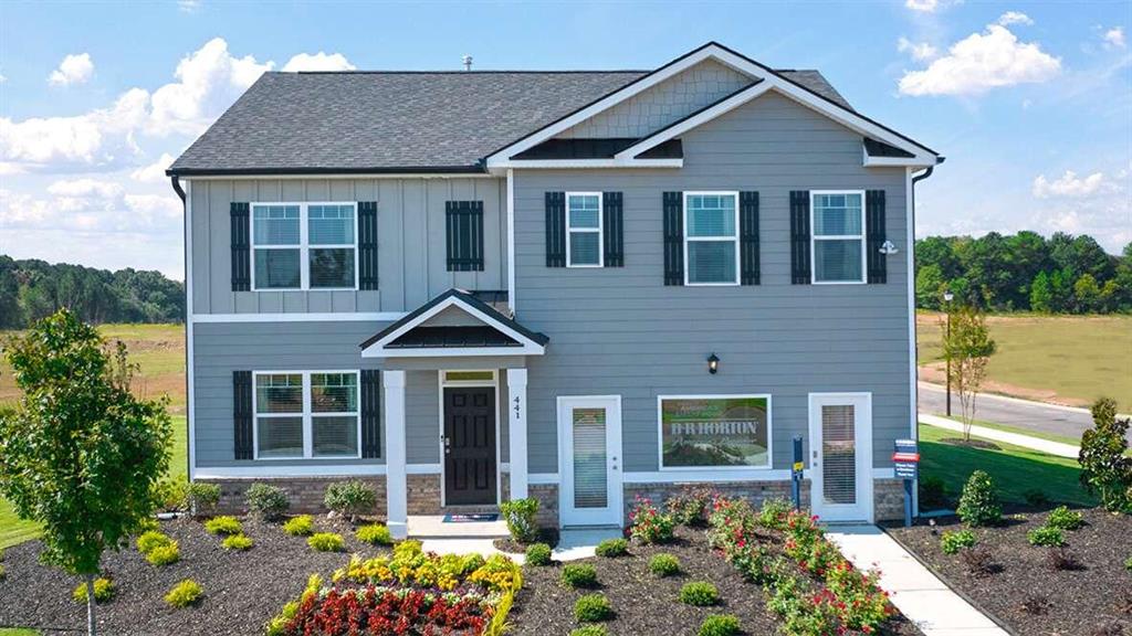 This home is a must see in the most gorgeous community in Jackson County!!! The Hayden floor plan is our most popular 5 bedroom home here at Twin Lakes. Owner's Suite is located on the 2nd floor and there is a guest bedroom and full bath on the main floor. This home is located in the master planned community of TWIN LAKES with AMAZING AMENITIES: RESORT STYLE POOL - CLUBHOUSE - FITNESS CENTER - PLAYGROUND - DOG PARK, LAKESIDE PAVILION - Adirondack CHAIRS and SWINGS. Watch the sunsets over the water and stroll around the serene LAKES and walking trails. Home features granite countertops and stainless steel appliances, hardwood floors on 1st floor except bedrooms & baths. Relax and enjoy your coffee in the morning, or a glass of wine with friends in the evening while grilling under the COVERED BACK PATIO. Total Price includes 2 zone lawn irrigation system, window blinds, 2 ceiling fans, garage door opener, architectural shingles, 4 sides brick water tables, etc. Smart Home connected. Jackson County's newest Premier Master Planned Community. Ask about the FREE 10 year warranty through RWC with this home! Twin Lakes is only 2.2 miles from I-85, 5 minutes to Downtown Hoschton/Braselton with their quaint shops, restaurants and local brewery. Northeast Georgia Medical Center is only 15 minutes away and Chateau Elan Winery and Golf Club is just 10 minutes away! NEW PUBLIX Supermarket is planned at the front entrance to Twin Lakes off Highway 53. Stock Photos used.