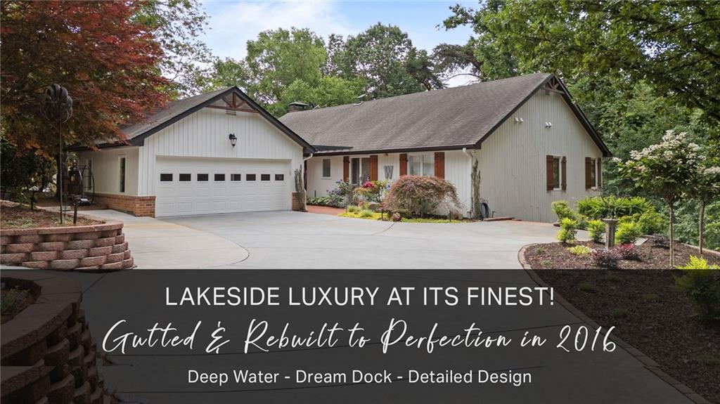 LAKE LANIER LUXURY AT ITS FINEST! Rarely does a home of this caliber become available. Tucked into a serene deep-water cove and rebuilt from the studs up in 2016, this fully permitted lakefront retreat blends timeless elegance with the laid-back joy of lake living! Every detail was built to current code with an eye for quality, style, and comfort. The crown jewel? A premium 32' x 32' aluminum Martin dock - the largest permitted on Lake Lanier - complete with Trex decking, electricity, lighting, water pump, Tritoon boat lift, dual jet ski ports, and an expansive upper party deck. A 40-foot rolling gangway with side rails leads to quiet, deep water just minutes from the open lake and lakeside dining. Inside, the main floor showcases beautifully crafted tray ceilings, abundant recessed lighting that adds warmth and dimension to every space, hand-scraped hardwood floors, and upgraded trim reflective of the quality craftsmanship throughout. At the heart of the home lies a stunning open-concept great room and dining area, anchored by a raised-hearth wood-burning fireplace with remote-controlled gas logs and framed by custom-built-in bookcases that add warmth and sophistication! Just steps away, the gourmet kitchen is a chef's dream-featuring top-of-the-line Thermador appliances, an oversized leathered granite island, a wine and beverage cooler, walk-in pantry, spice drawers, a discreet built-in appliance garage, and a large walk-in pantry! The owner's suite is a peaceful sanctuary, complete with an expansive walk-in closet and a spa-inspired bathroom featuring whitewashed wood walls, marble finishes, a deep freestanding soaking tub, and a spacious walk-in shower with ceiling-mounted rain shower head, an indulgent retreat designed for relaxation! A second main-level bedroom suite offers guests both comfort and privacy with its own en suite bath and oversized walk-in closet! Indoor and outdoor living come together beautifully in the all-seasons sunroom with tranquil treetop views, an oversized Trex grilling deck with gas hookup, and a private front courtyard featuring a built-in firepit - perfect for cozy evening gatherings under the stars. On the terrace level, a covered outdoor lounging area offers year-round comfort, while the expansive party deck delivers the ultimate setting for lakeside entertaining. The terrace level is equally impressive, featuring a spacious family room with a second wood-burning fireplace, complete with remote-controlled gas logs, framed by elegant custom built-ins. A full kitchenette with custom cabinetry and soapstone countertops adds convenience for entertaining. Two generously sized bedrooms offer both indoor and outdoor access, accompanied by two full baths, including one with direct exterior entry for easy trips to and from the lake. A versatile flex room provides endless possibilities, whether used as a fifth bedroom, home office, gym, or game room. An oversized storage room adds valuable functionality and is perfect for organizing lake gear, crafting, workshop space, or even a future wine cellar. Wide-plank, water-resistant luxury vinyl flooring flows throughout, perfectly suited for life by the water. Additional highlights include spray foam insulation, three HVAC zones, an upgraded central vacuum system, dual security systems (one per floor), Starlink internet access on every level, Rainbird 5-zone irrigation, custom closets throughout, and fresh paint inside and out. Professionally landscaped grounds complete the picture. This is your chance to own a turn-key luxury home in one of Lake Lanier's prime locations - with the added benefit of low Forsyth County taxes with a Gainesville address. Schedule your private showing today and start living the lake lifestyle you've always imagined - just in time for the best of the season.