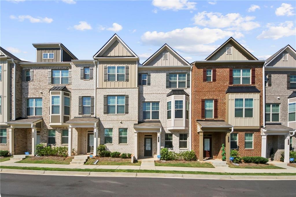 Exceptional Opportunity! Assumable 4.8% Loan Available! This is an absolutely unbeatable opportunity to own a magnificent 3-story townhome in the highly sought-after gated community of Towns at Enclave, where luxury living meets unprecedented financial advantage in today's competitive real estate market. This exceptional residence features a thoughtfully crafted open floor plan with 3 generously sized bedrooms and 3.5 bathrooms. Step through the front door and immediately experience the 9-foot ceilings on both the first and second floors that create an incredibly airy, spacious atmosphere throughout every room of this magnificent home. The true heart of this residence is the spectacular gourmet kitchen, a chef's dream equipped with granite countertops that provide both beauty and functionality. Flowing seamlessly from the kitchen, you'll discover a spacious and inviting family room that serves as the perfect gathering space. This prime location in charming Lawrenceville offers residents the perfect balance of suburban tranquility and urban convenience, with easy access to the vibrant downtown area featuring an impressive array of retail shops, diverse dining establishments ranging from casual to fine dining, and entertainment options for every taste and lifestyle preference, while the strategic proximity to major highway routes offers effortless commutes to Atlanta. Most importantly, seize this incredibly rare financial opportunity to assume the seller's existing mortgage at a desirable 4.8% interest rate. This significant advantage will help secure your family's place in a managed residential community.