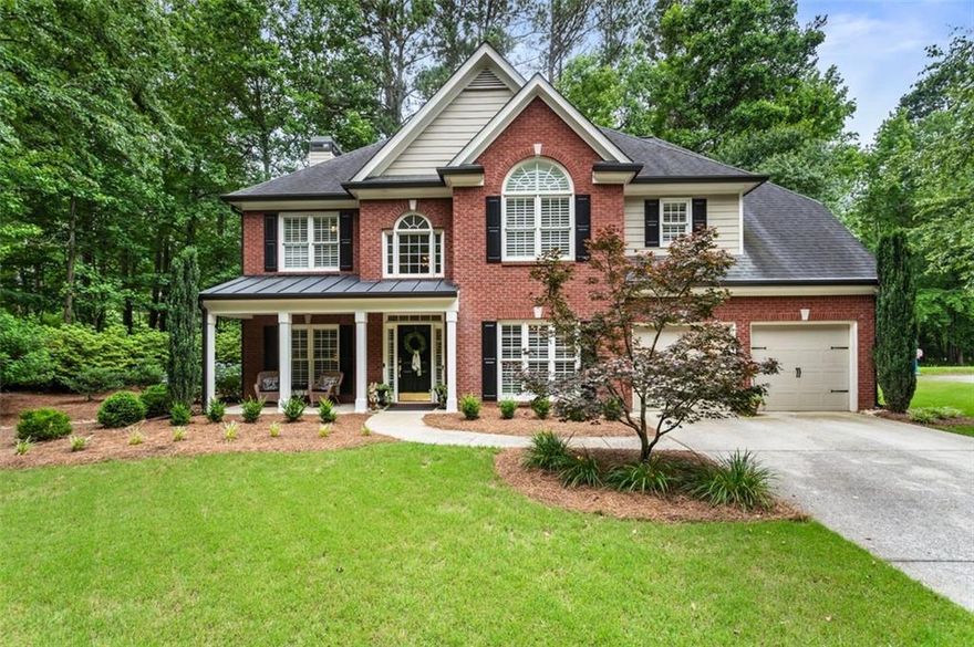 Better than New Construction! Stunning and Professionally Decorated Home that is Immaculate!  Hardwood Flooring on  Main Level* Front Porch with Room for Rocking Chairs* Formal Dining Room has Tray Ceiling and Chair Rail*  Living Room would be perfect for Reading or Home Office*  The 2 Story Family Room has a Wall of Windows and Brick Fireplace with Gas Logs* Plantation Shutters grace the Front of the Home*   Open Floor Plan with Breakfast Area and Kitchen has Large Island with Pendant Lighting, Granite Counters, Stainless Appliances, including Microwave and Refrigerator* and Built In Desk*  The Main level Laundry Room is so cute with a Brick Floor, Cabinets for Storage and Washer and Dryer to Remain*  Primary Bedroom has a Sitting Area, Double Tray Ceiling, Tiled Bathroom Flooring and Shower, Garden Tub and Walk In Closet*  All 3 Guest Bedrooms are spacious and there is a 2nd Full Bath upstairs with Double Vanities*   Smooth Ceilings throughout*  The Rear Patio is Perfect for Grilling and Entertaining*  Beautiful Lush Lawn and Landscaping*  Great West Cobb Schools, (Harrison HS)* Take a walk to the local Coffee Shop or Swim in the Community Pool*  2 Car Garage with Level Driveway*  Termite Bond in Place*  This Home Truly is a Great Value for this Location and Price!!