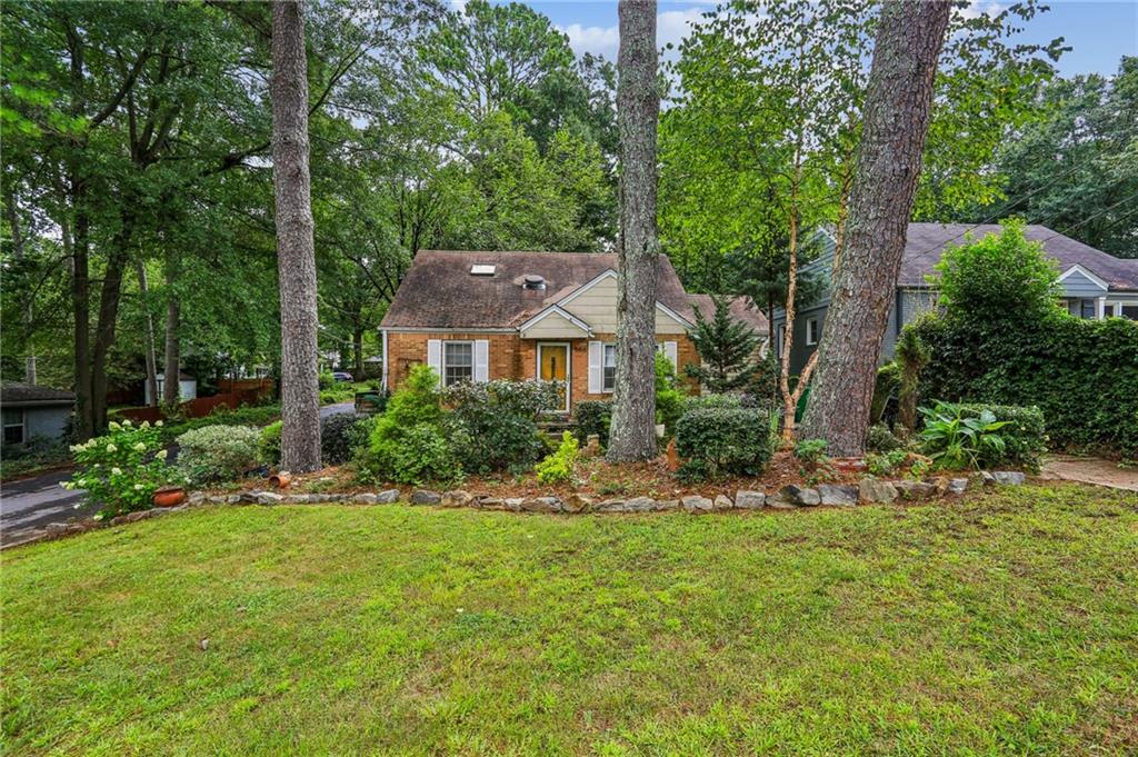 Best value in East Lake Terrace on landscaped corner lot! This 3-bed, 2 full bath cottage has hardwoods and potential throughout. The backyard is an entertainer’s dream with established garden beds, miniature greenhouse, and outdoor office steeped in natural light. Enter the living room with full laundry/utility room off it. The open-concept dining/kitchen has white vintage cabinetry and separate pantry space. Down the hall are two bedrooms and shared full bath. The upstairs has private bath, multiple storage options and owner’s bedroom. Just blocks to East Lake Golf Course, Buena Vista Lake/park, and dining/shopping! Schedule today to see 586 Daniel!