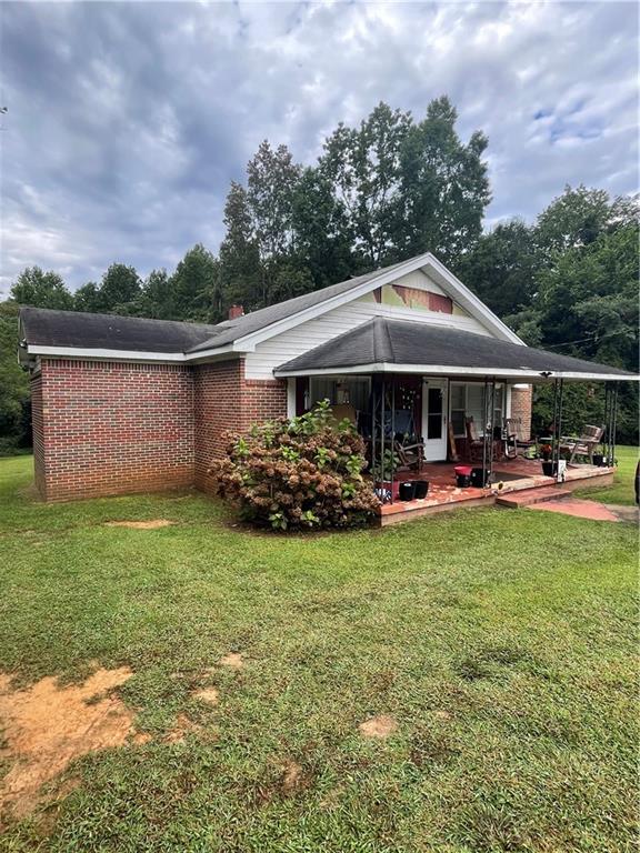 Check out this charming, 3-bedroom, 2-bath brick ranch home, perfectly situated on a spacious lot along Hwy 27. Step inside to discover a home filled with character and potential, featuring nice living spaces, a cozy fireplace, and a functional layout ideal for families or anyone seeking single-level living. Outside, enjoy a big backyard with plenty of room for entertaining, gardening, or simply relaxing on the deck or covered front porch. Whether you're looking for your first home, downsizing, or investing, this well-built home is ready for your personal touch.