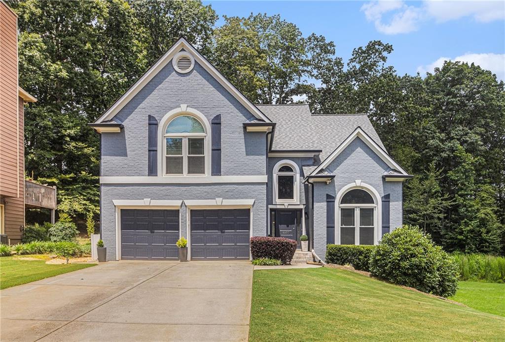 Stunning Remodeled Home in the Heart of Woodstock! This beautifully updated 4-bedroom, 3.5-bath residence perfectly blends modern style with Southern charm. Inside, you'll find a bright open-concept floor plan featuring luxury finishes, abundant natural light, and thoughtful upgrades throughout. The gourmet kitchen boasts granite countertops, stainless steel appliances, and an island—ideal for entertaining. The spacious primary suite offers a spa-inspired bath and a generous walk-in closet. The finished basement includes a full bath, offering flexible space for guests, a home office, or media room. Step outside to your private backyard retreat complete with an expansive deck and cozy fire pit. Nestled on a quiet street just minutes from Downtown Woodstock, top-rated schools, shopping, dining, and parks—this is the home you've been waiting for!