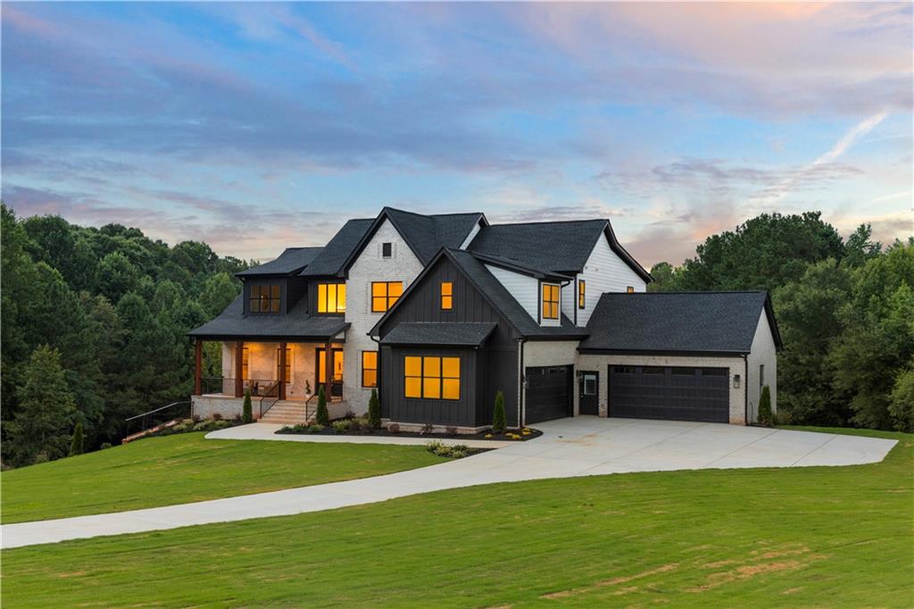 Welcome to your dream farmhouse retreat! Nestled on a sprawling 22 acres of picturesque land, this stunning 7-bedroom, 6.5-bathroom farmhouse offers the perfect blend of modern comfort and charming country living. As you enter, you'll be greeted by a spacious and inviting open-concept layout, perfect for entertaining family and friends. The large living area features cozy accents and plenty of natural light, while the gourmet kitchen is a chef's paradise, boasting high-end appliances, ample counter space, and a generous dining area. Each of the seven bedrooms is designed for relaxation, with en-suite bathrooms that provide privacy and convenience. The master suite is a true sanctuary, complete with a private balcony for stunning views of the surrounding landscape and a luxurious private bath. Upstairs, you’ll find an open loft area that can serve as a cozy reading nook, a play area, an additional seating room or a versatile space for your personal needs.
Step outside to enjoy the beauty of nature, where outdoor fireplaces on each deck level create the perfect ambiance for gatherings or quiet evenings under the stars. Enjoy the tranquil surroundings with the private property pond. The expansive outdoor spaces are ideal for gardening, outdoor activities, or unwinding in your own slice of paradise. The full basement offers endless possibilities, whether you're looking for extra storage, a game room, or a home gym. With its serene setting, spacious interiors, and luxurious outdoor features, this farmhouse is not just a home; it's a lifestyle. Don’t miss your chance to own this extraordinary property! Schedule your private showing today!