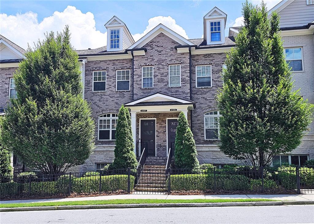 This incredible luxurious three level newer construction is in the coveted GATED "The Townes at Chastain" community in the city of Sandy Springs. You'll enjoy luxurious and low maintenance living. This home has quality design and finishes, plus a lifestyle great for entertaining. The spacious 2 bedroom/2 bath/2 1/2 baths townhouse screams designer. You'll enjoy a blend of luxury, comfort, and convenience with an ambiance which is inviting and sophisticated. LOCATION, LOCATION, LOCATION. You're in an ideal location with everything at your fingertips and moments from treasured Chastain Park & Amphitheater, great shopping, casual and fine dining, and entertainment. The exteriors are elegant with brick and cement siding. You'll enjoy a luxurious interior with over $40,000 in Builder upgrades, low maintenance, and an energy efficient lifestyle. A few energy efficient features: appliances, gas hot water heater, HVAC, thermostat, fully insulated walls, ceiling & attic, dual pane windows. You're "WOWED" upon entering with open concept living, bathed in abundant natural light, soaring 10" ceilings, upgraded decorator lighting, recessed lighting throughout, and beautiful upgraded wood floors throughout, (carpet in 2nd bedroom). There's an impressive front entrance to the building with gate, porch and welcoming foyer. Take foyer to a lovely formal dining room with great windows, chandelier, and upgraded brick wall. The dreamy chef's kitchen, is the heart of the home, has abundant white custom cabinets all the way to the ceiling, and under cabinet lighting, Countertops are beautiful, chiseled edge granite, ceramic tile backsplash, stainless energy efficient appliances, large island, breakfast bar, and pantry. Spacious family room has floating shelving, an upgraded brick wall, and a cozy modern electric fireplace with flame and mood lighting settings. Everyone will enjoy the relaxing deck off the family room. The main floor powder room has lovely upgrades with two decorative glass tile walls, wood cabinetry, and oversized sink. Upper level has two en-suites with a desirable roommate floor plan. Both bedrooms have upgraded 10' tray ceilings. The stately master en-suite has great windows, huge closet, and spa-like master bath with upgraded vaulted ceiling, dual vanities, wood cabinetry, and huge walk-in frameless glass shower with dual showerheads. The secondary bedroom en-suite with 10' tray ceiling has a large walk-in closet, and private tile bath. Laundry closet is conveniently located upstairs-washer/dryer remain. You'll love the additional space on the terrace level with a wonderful bonus room/flex space, powder room, and one car garage with custom epoxy flooring. A security system is in place. "The Townes at Chastain" is a walkable lifestyle community with a sparkling community pool, outdoor grill area, and peaceful seating areas in the community. In 2019, the subdivision was named "Community of the Year" by the GA Home Builders Association. THIS TOWNHOUSE HAS IT ALL!