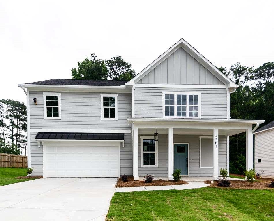 Discover luxury living in this stunning 4-bedroom, 3.5-bathroom new construction home, strategically located near Oakhurst, EAV, Kirkwood, & Downtown Decatur. The Ansley floorplan offers convenience and style, featuring a main-level guest bedroom with a full bath, perfect for hosting guests. Entertain with ease in the open kitchen, showcasing quartz countertops, painted white cabinets with soft-close doors, a spacious island, walk-in pantry, and stainless-steel appliances. Gleaming hardwood floors flow seamlessly throughout the main level, enhancing the home's sophisticated charm. Upstairs, unwind in the expansive loft area, ideal for a cozy retreat or additional living space. Escape to the owner's suite, complete with a trey ceiling, generous walk-in closet, and a spa-like bath adorned with quartz countertops, double vanities, a tiled shower, and a luxurious soaking tub. Two additional guest bedrooms share a beautifully appointed Jack & Jill bath, offering both style and convenience. Don't miss this exceptional opportunity to schedule your showing today! Seller will pay up to $7,000.00 towards closing cost if using the preferred lender.