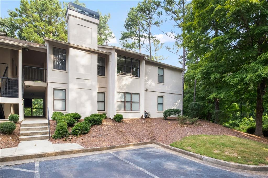Welcome Home to this spacious 2 BRM/2 BA updated condo, located in the highly desirable Brandon Mill Farms community in Sandy Springs! This move-in-ready home is one of the nicest in the community! Unit is located on the first floor, overlooking the pool, in a very private location, has fresh paint and new LVP designer floors throughout! The home is flooded with natural light, backing up to a large green space for dog walking and relaxing, with a beautiful tree-lined view. This home boasts an updated full kitchen with Modern kitchen cabinetry, plenty of counter space and storage. Open floor plan for easy entertaining, with seamless flow between living spaces, creating a cozy and comfortable setting to spend time with family and friends. A roomy bathroom includes a tub/shower combination and privacy! Hall laundry closet for a full size washer and dryer and storage! This enchanting private community offers walkability, is pet-friendly, has a community lake, swim/tennis, and has ample parking for guests! Close to everything… Schools, Shopping, Dining, North Springs Marta, and minutes to Northridge/GA-400! Trifecta convenience to Sandy Springs, Dunwoody, and Old Roswell!