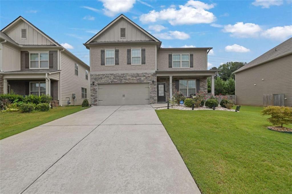 Welcome to this charming 5-bedroom, 4-bathroom home in the desirable Centennial Lakes community in Acworth! Better than brand new, this house was built in 2018 and is in immaculate condition ready for your family to enjoy. Featuring wide plank LVP flooring on the main level and the stairs. The living room and a separate dining room with coffered ceilings provide an elegant entrance that flows seamlessly into the kitchen. The Chef's dream kitchen boasts white cabinets, stone countertops, vent hood, island and a breakfast room with a views of the fireside family room, making it an ideal space for both cooking and entertaining. The oversized primary bedroom is upstairs with a cozy sitting space. While the ensuite bathroom includes a separate shower and tub, double vanities, and a large walk-in closet. Another two full bathrooms with glass enclosed tub & showers are on the same level. An extensive remodeling worth over $60,000 has just been completed on this updated single-family house. The spacious backyard with plenty of green space is ready for your outdoor gatherings. The home also includes an attached 2-car garage. Located in a great area with easy access to I-75, Downtown Acworth. You'll love living in this community full with great amenities! Enjoy the convenience of quick access to I-75, Downtown Acworth with shopping and dining just minutes away. A MUST SEE!