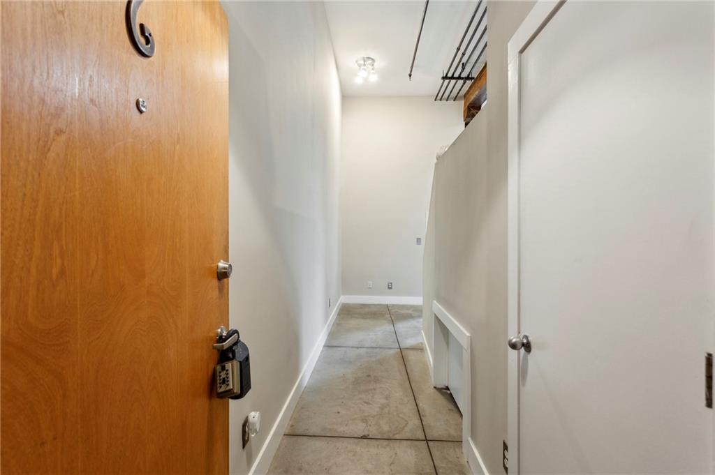 One of a kind condo in the heart of the Castleberry Hills neighborhood. Walkability meter is off the charts! You have all of downtown Atlanta at your fingertips with restaurants, bars , and entertainment at your fingertips. This building is spectacular. The interior features exposed brick and extremely high ceilings. The kitchen features stained cabinetry, solid surface countertops, a viking double oven, a separate cooktop and a brand new dishwasher and fridge. The bedroom is oversized with its own closet. The bathroom features a separate jacuzzi tub and shower as well as a double vanity. This unit features great sunlight as well as its own loft with permanent stairs for additional living space. A Nest thermostat has been installed to help keep your utility bills down. There is a rooftop deck in this building which is currently under construction. This building requires you get on the waitlist for rentals. YOU MUST USE SHOWINGTIME TO SCHEDULE APPOINTMENTS AND TO GET THE GATE CODE. $1500 BROKER BONUS FOR IF CLOSED BEFORE 10/1/2025.