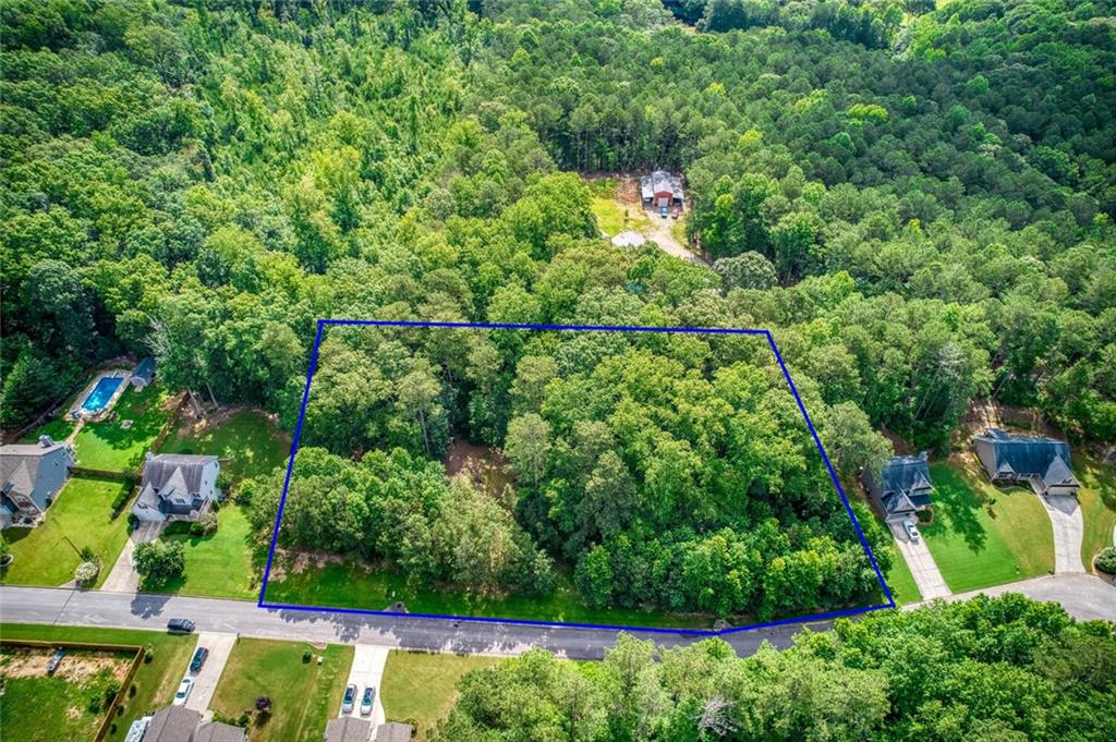 Bring your builder for this super piece of land in Henderson Ridge Subdivision in Dallas GA, located in the South Paulding High School District, this piece of land is 3 lots combined for a total of 1.74 acres with a great area to build a home, and plenty of leftover land for toys and parking! Curbs are in place, electrical and water on the street, you will need to put in your septic system. Sellers can close quickly and are open to offers. Come take a look and let's make a deal, schedule your walk-about with your agent