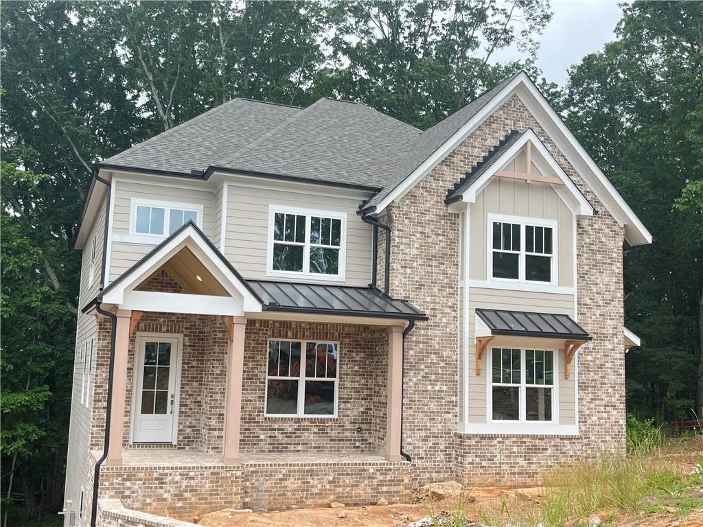 Lot 4 Wesleyan - FINAL OPPORTUNITIES - MOVE IN READY Custom home with basement and 2 car garage nestled on 1.38 acre cul de sac homesite offering amazingly large side yard - You'll love living in Liberty Springs, a Woodstock community of only 10 homes on large homesites. You'll enjoy the easy flow of Windsong Properties' popular Wesleyan floor plan on a full unfinished daylight basement. This home offers wide-open living spaces to enjoy with your family and friends. Along with the soaring 10-foot ceilings on main level and 9-foot on second level, this home is decked out with high-end options you won't find anywhere else - quartz countertops, Shrock Entra cabinets, Kitchen Aide appliances, custom tile in all baths, showers and laundry room and a freestanding soaking tub in the owner's bath along with a large tiled shower with frameless shower door. Located in the cul-de-sac on a 1.38 acre lot backing to trees, you'll love the privacy and the large backyard and covered deck.
This home offers a large owner's suite upstairs, a Guest bedroom/office and a full bathroom on the main level. The main level bath is finished with a tiled standing shower and frameless shower door for a total of five bedrooms and four baths. Enjoy the open feel as you enter the main level with soaring ceiling heights and cozy up with modern gas log fireplace in Great Room. The second floor has 4 spacious bedrooms, 3 baths (Owners spa bath, a Jack & Jill and an ensuite bath) and a large tiled laundry room with laundry sink. Each bedroom is spacious with generous-sized closets.
Photos are a mix of actual and staged Wesleyan plan at Lot 9.