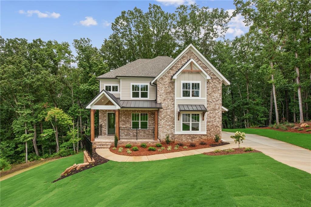 Lot 4 Windsong’s Wesleyan plan - FINAL OPPORTUNITY to experience this awesome community! MOVE IN READY Custom home with basement and 2 car garage 5 bedrooms and 4 full baths and loft/reading room with covered deck nestled on 1.38-acre cul de sac homesite offering an amazingly large side yard that extends into the trees for many hours of fun for the kids! You'll love living in Liberty Springs, a Woodstock community of only 10 homes on 1 + acre homesites. Liberty Springs is conveniently located close to schools, Hickory Flat, Crabapple and Woodstock and is a community by Obie and Guildmaster award-winning builder Windsong Properties! You'll enjoy the easy flow of Windsong Properties' popular Wesleyan floor plan on a full unfinished daylight basement with concrete patio. This home offers wide-open living spaces to enjoy gatherings of all kinds. Along with the soaring 10’ ceilings on main level and 9’ on the second level, this home is complete with high-end options you won't find anywhere else. Located in the cul-de-sac on a 1.38 acre lot backing to trees, you'll love the privacy of the covered deck for your morning coffee!
This home offers a Guest Suite/office and a full bathroom on the main level. The main level bath is finished with a tiled standing shower and frameless shower door. Enjoy the open feel as you enter the main level with soaring ceiling heights and cozy modern gas log fireplace in Great Room. Enjoy time with family and friends while in the adjoining gourmet kitchen equipped with 42” cabinets with soft close doors and drawers, gourmet Kitchen Aide stainless appliances - large vent hood, gas cooktop, built-in microwave/oven, dishwasher and beautiful quartz countertops and tiled backsplash.
The second level has a great flow of 4 spacious bedrooms, 3 baths and a large tiled laundry room with laundry sink. With laundry access from owners closet and additional bedroom hallway, laundry is an easy! Your Owners Suite has room for a sitting area with a dramatic spa bath with large tiled shower, frameless shower door, separate vanities and a striking stand-alone tub. The 3 additional bedrooms are spacious with generous-sized closets.
Sod with sprinkler system.