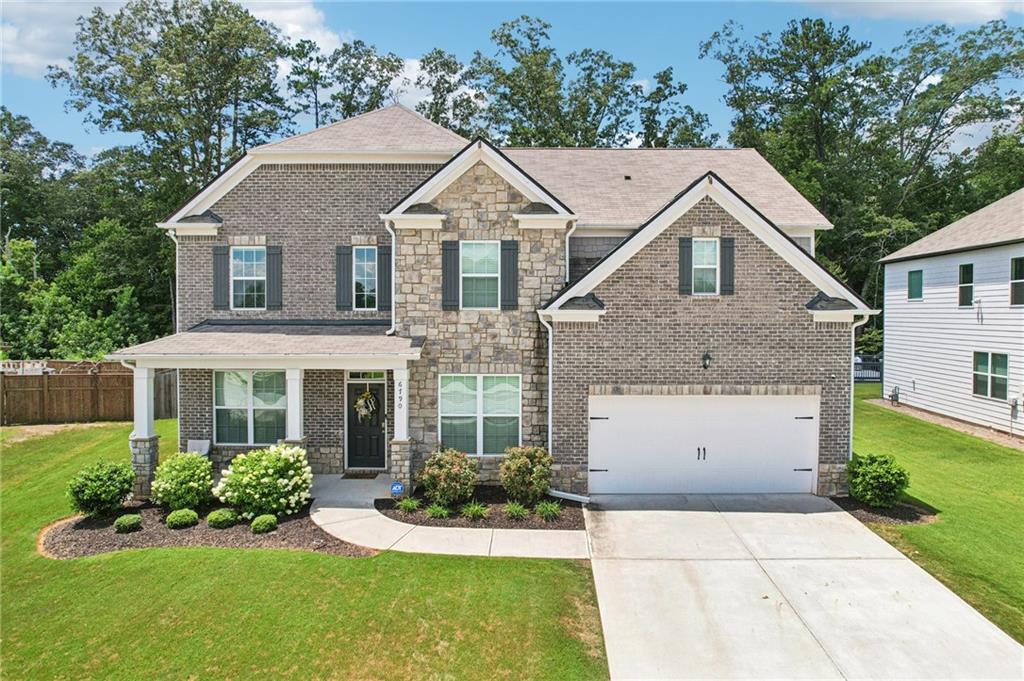 Don't miss this extraordinary opportunity! Discover the epitome of luxury, functionality, comfort, and spacious living in this perfectly crafted beautiful and meticulously maintained 5-bedroom, 3-bathroom, 2-car garage dream home! Built in 2021 by D.R.Horton, this well-sought out Savannah floor plan is a home no one forgets!
From the moment you arrive, the professionally landscaped front yard and professionally custom installed exterior uplighting & soffit downlighting enhances the home’s stunning craftsmanship and undeniable curb appeal. With one of the largest lots in the neighborhood, you can enjoy the huge fenced-in private back yard, perfect for tranquil mornings, kids at play, weekend football games, or hosting unforgettable holiday gatherings.
Welcome into the elegant 2-story foyer, leading to a formal dining room with coffered ceilings and seating for 8+, a formal living room or flexible home office, a warm & inviting family room with a cozy stack stone fireplace opening to the gourmet kitchen complete with an island perfect for entertaining, 42" upgraded cabinets, a double oven, upgraded countertops, stainless steel appliances, and exquisite LVP flooring! A guest bedroom along with a full bath is conveniently located on the main level. Stepping into the breathtaking owner's retreat will not disappoint, featuring the renowned 'wow-factor' step-up sitting room with a warm and inviting fireplace, an impressive retreat to relax in style.
The spa-like ensuite bath offers a tiled 5ft shower, soaking tub, tiled floors, upgraded vanity countertops, and a huge walk-in closet. The upper level also hosts generously sized secondary bedrooms, a spacious laundry room, and all the convenience you expect from a Smart Home. Checking all the boxes for modern living!
Located in a swim/tennis/clubhouse community within the desirable Westlake High School district, this home offers easy access to I-20, I-285, Hartsfield-Jackson Airport, and is just 30 minutes from Downtown Atlanta. Close to shopping, dining, entertainment, schools, and the local library.
Move-in ready and truly one-of-a-kind—hurry to schedule your showing and make this one your new home today!
