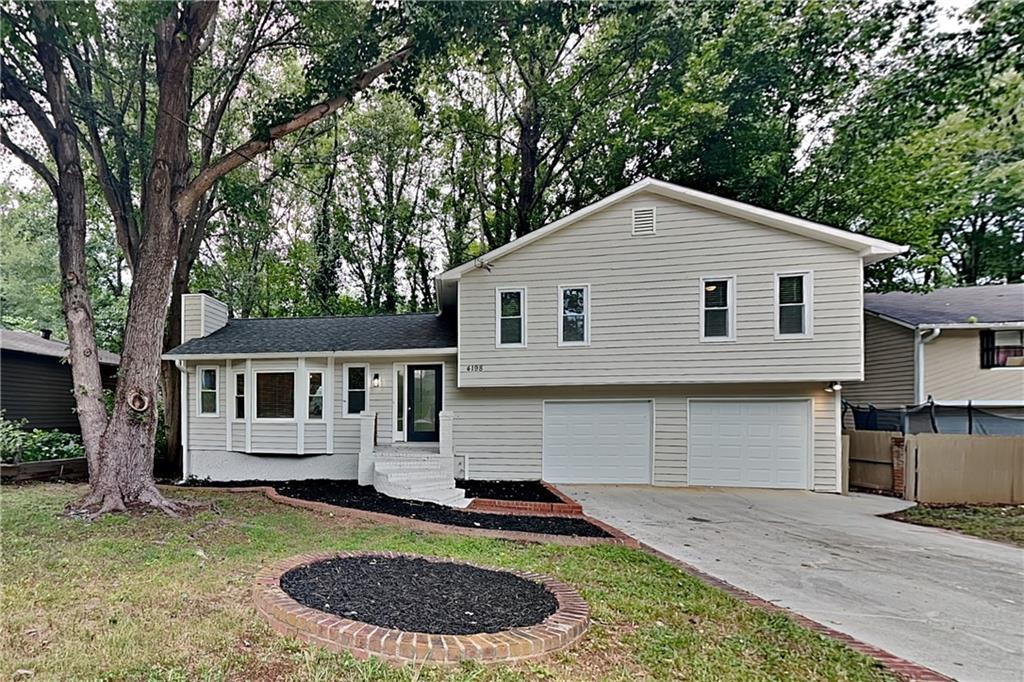 Charming 3 bed, 2 bath, 2,050 sq ft home in Duluth! Open kitchen concept with updated counters and a spacious living room. Master suite with attached bathroom. Spacious backyard, great for gatherings! Pets accepted on a case by case basis. Additional admin fees apply. The Fireplace is decorative. Schedule your showing today!