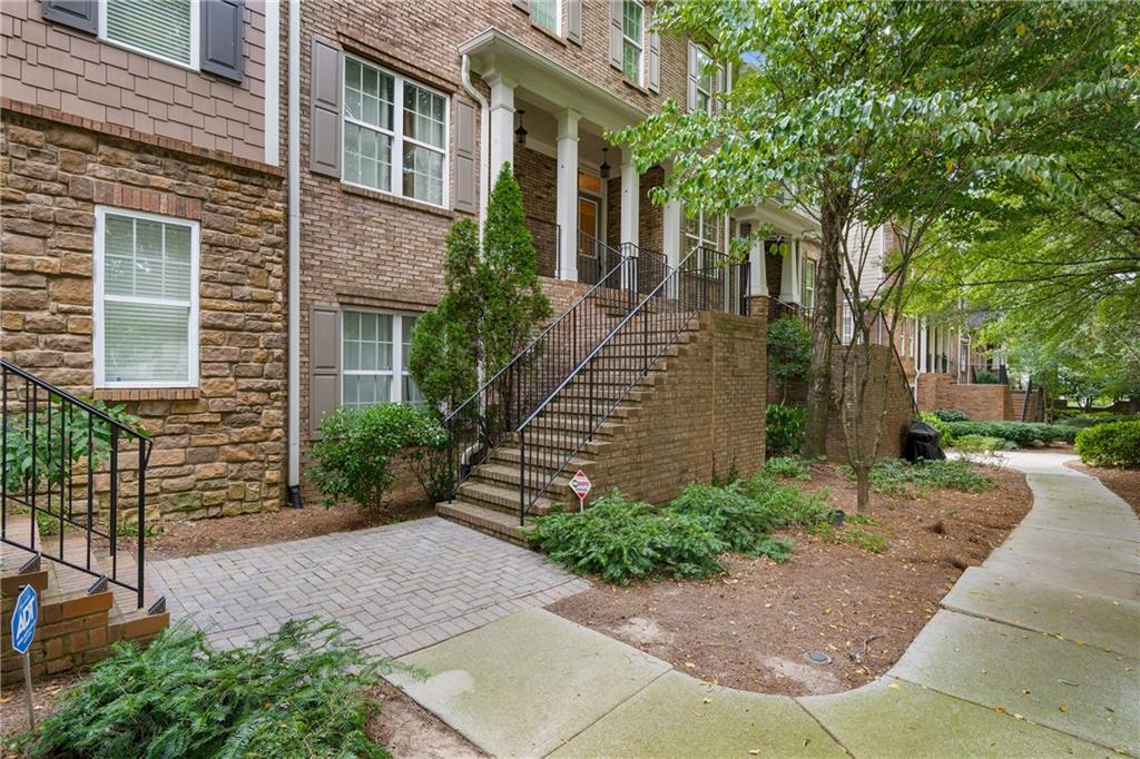 Located in a gated community, this beautifully designed townhome offers space, style, and incredible convenience. The open main level features a chef’s kitchen with granite countertops, stainless steel appliances, and a large island, flowing seamlessly into a light-filled great room with gas fireplace, built-ins, and wine rack. French doors open to a spacious deck—perfect for entertaining or relaxing. Upstairs, the oversized primary suite boasts soaring ceilings, a spa-like bath with separate tub and shower, and a custom California-style closet. A secondary bedroom with en-suite bath adds flexibility, while the terrace-level room, with full bath, makes an ideal office or guest space. A two-car garage and unbeatable location, just across from Briarwood Park, complete this exceptional home.
