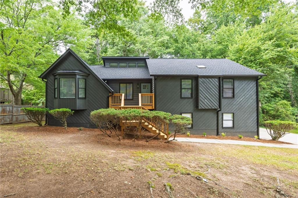 This charming 3-bedroom, 2-bath residence features fresh interior/exterior paint, brand new flooring throughout, and stylish new light fixtures that brighten every space. Enjoy cooking in the updated kitchen with brand new appliances, perfect for both everyday living and entertaining. Stay comfortable year-round with a brand-new HVAC unit and rest easy under a brand-new roof. Step outside to a spacious brand-new deck—ideal for grilling, relaxing, or gathering with friends. Conveniently located near shopping, parks, and top-rated schools, this move-in ready gem offers modern upgrades and timeless charm. Don’t miss it!