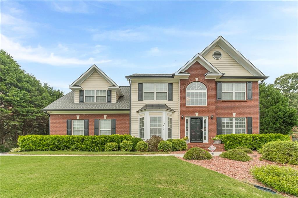 This 4BR and 2.5 BA home on a full finished basement and nearly an acre has been meticulously maintained by its original owner and is waiting for you. The brick front & beautifully manicured front yard invites you into your two-story foyer, formal living room and dining room. The main floor has a large family room with a gas fireplace, a bright kitchen with a cozy eat in area, a half bath and oversized laundry room. All four large BR's are upstairs, and the extremely welcoming primary bedroom has a tray ceiling and sitting area. Your fully finished basement is set up with a game area, exercise space, additional hang out space with a bar area and full bathroom. Your backyard oasis is the final piece that you will not want to walk away from with its deck, paved area, spacious flat land and garden. This home is just what you have been looking for!