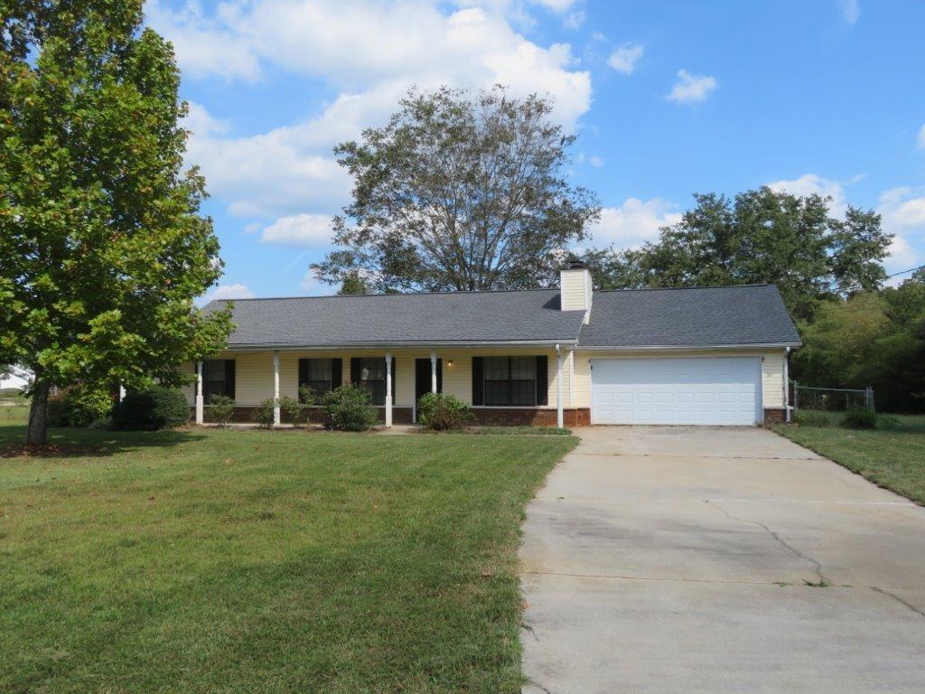 Beautiful, ranch home on a 0.75 acre, corner lot! Rocking chair front porch! Spacious living room! Separate dining/breakfast area off kitchen! Kitchen features white cabinets, stone counters, and stainless steel appliances! Primary bedroom features his & her separate closets and a private full bathroom! Two spacious secondary bedrooms share another full bathroom! Rear patio overlooks level, fenced backyard! A must see! Don't miss out!